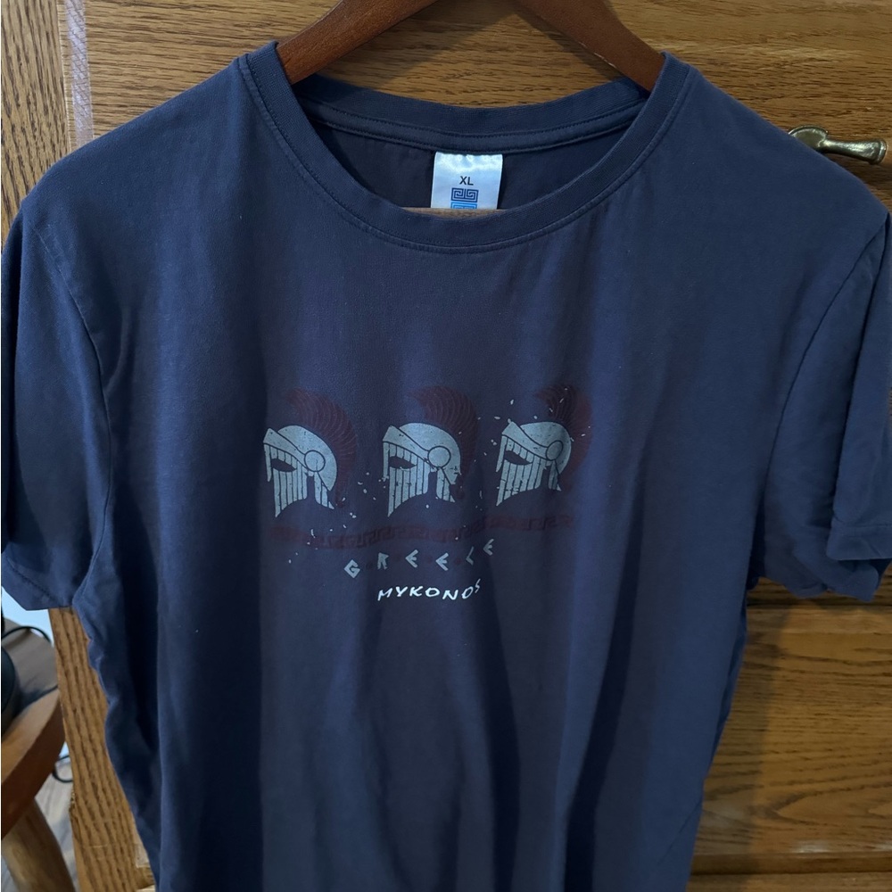 Bought in the islands and it fit perfectly. Washed once, fits like a men’s LG